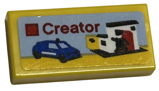 Tile 1 x 2 with LEGO Creator Set Box Art, Blue Car, Police Station, and Black Policeman Minifigure Silhouette Pattern (Sticker) - Sets 40528 / 40574