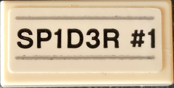 Tile 1 x 2 with Black 'SP1D3R #1' and Light Bluish Gray Lines Pattern (Sticker) - Set 76174