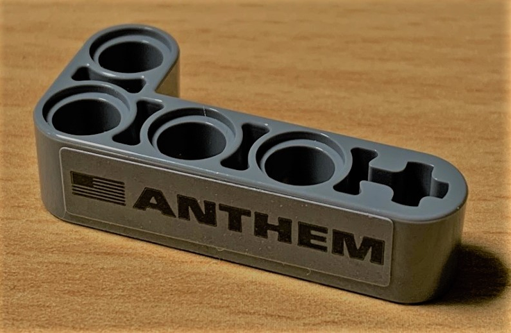 Technic, Liftarm, Modified Bent Thick L-Shape 2 x 4 with 'ANTHEM' and Black United States of America (USA) Flag Pattern (Sticker) - Set 42078