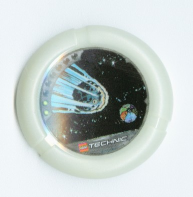 Throwing Disk with Throwbot Flare 2 Pips, LEGO Technic Logo, and Meteor Heading to Sectioned Planet Pattern