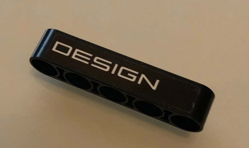 Technic, Liftarm Thick 1 x 5 with White 'DESIGN' on Black Background Pattern (Sticker) - Set 42096