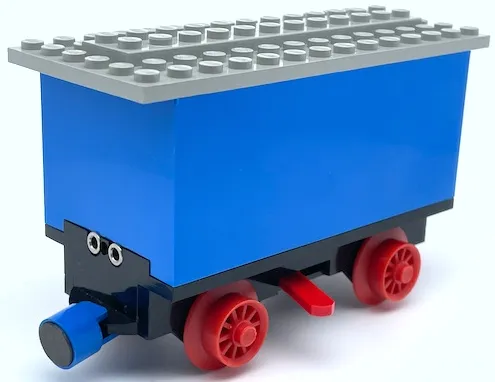 Train Battery Box Car with Three Contact Holes, Red Switch Lever, Blue and Red Magnets, Red Wheels, and Light Gray Roof