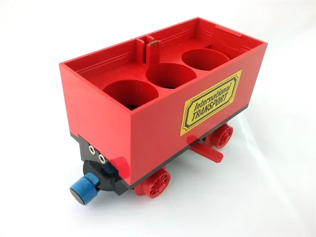 Train Battery Box Car with Two Contact Holes, Red Switch Lever, Blue and Red Magnets, and Red Wheels with 'International TRANSPORT' Pattern on Both Sides (Stickers) - Sets 161 / 181-1 / 183