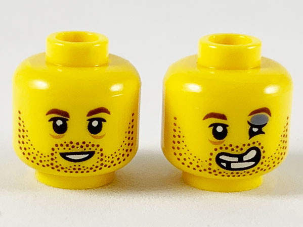 Minifigure, Head Dual Sided Reddish Brown Eyebrows and Stubble, Smile / Injured Left Eye and Broken Teeth Pattern