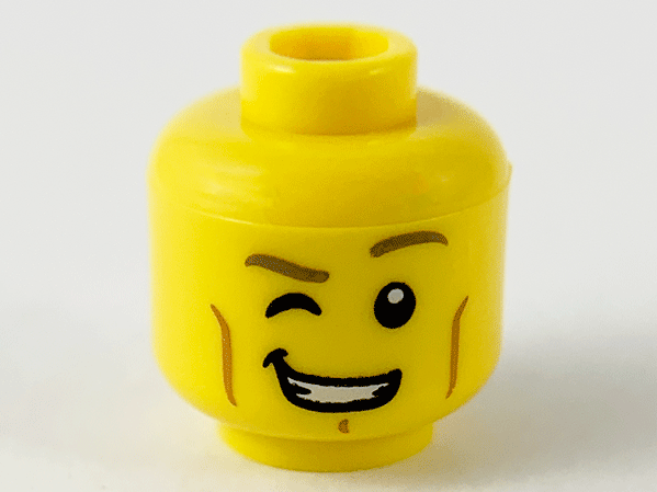 Minifigure, Head Dark Tan Eyebrows, Right Eye Winking, Medium Nougat Cheek Lines and Chin Dimple, Lopsided Open Mouth Smile with Teeth Pattern (BAM)