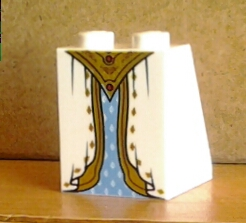 Slope 65 2 x 2 x 2 with Bottom Tube with Minifigure Dress / Skirt / Robe, Layered with Medium Blue Panel and Gold Belt and Sash Pattern