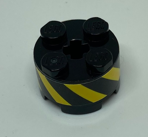 Brick, Round 2 x 2 with Axle Hole with Black and Yellow Danger Stripes Pattern (Sticker) - Set 70610