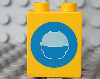 Duplo, Brick 1 x 2 x 2 with Head in Construction Helmet on Blue Circle Pattern