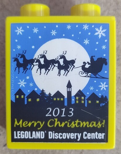 Duplo, Brick 1 x 2 x 2 with LEGOLAND Discovery Center, '2013 Merry Christmas!', Moon, Snowflakes, Skyline, and Santa's Sleigh with Reindeer Pattern
