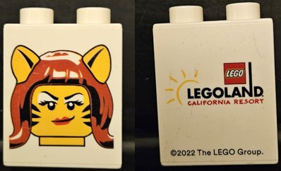 Duplo, Brick 1 x 2 x 2 with Tiger Woman Minifigure Head (Halloween / Brick or Treat) and LEGOLAND CALIFORNIA RESORT Pattern