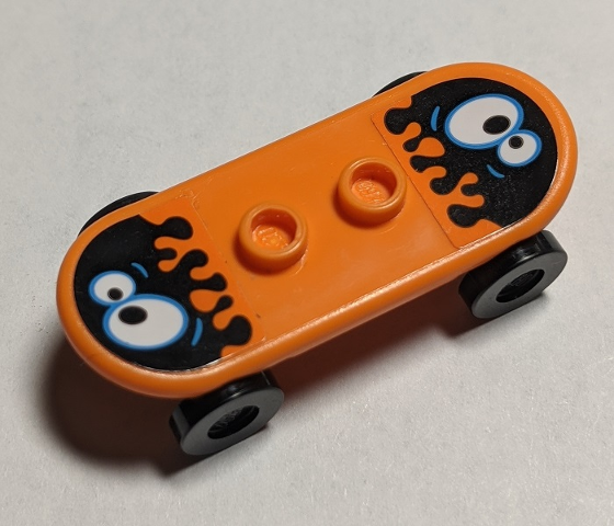 Minifigure, Utensil Skateboard Deck with Black Oil Blobs and White Eyes Pattern (Stickers) with Black Wheels (42511pb27 / 2496) - Set 60200