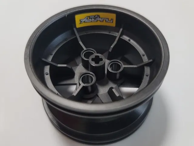 Wheel 56mm D. x 34mm Technic Racing Medium, 3 Pin Holes with White 'NUTRAX Tyres' on Yellow Background Pattern (Stickers) - Set 42000