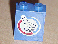 Panel 1 x 2 x 2 - Solid Studs with Space Shuttle and Blue and Red Semicircles on White Circle Background Pattern Model Left Side (Sticker) - Set 6544