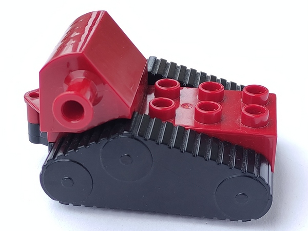 Duplo Crawler Backhoe Caterpillar 4 x 5 x 3 with Black Undercarriage with Four Wheels and Fake Treads