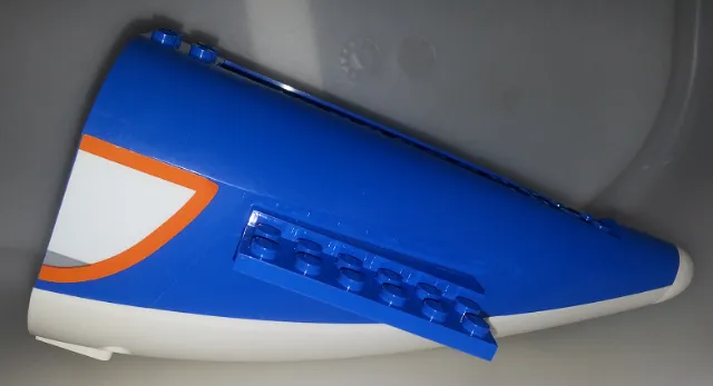 Aircraft Fuselage Aft Section Curved with Fixed White Base and White Hard Rubber Tip with Orange, Light Bluish Gray, and White Panel Pattern on Both Sides (Stickers) - Set 60104