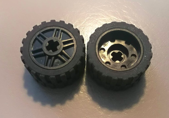 Wheel 18mm D. x 14mm with Axle Hole, Fake Bolts and Shallow Spokes with Black Tire 24 x 14 Shallow Tread - Band Around Center of Tread (55982 / 89201)