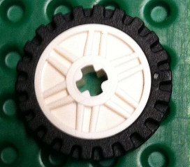 Wheel 18mm D. x 8mm with Fake Bolts and Shallow Spokes and Axle Hole with Black Tire 24mm D. x 7mm Offset Tread - Band Around Center of Tread (56903 / 61254)