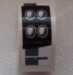 Slope, Curved 2 x 1 x 1 1/3 with Recessed Stud with Black 'DMG MORI' and Headlights Pattern Model Left Side (Sticker) – Set 75876