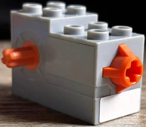 Windup Motor 2 x 4 x 2 1/3 with Orange Axle and Release Button with White Rectangle Pattern (Sticker) - Set 7738