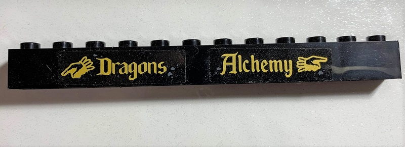 Brick 1 x 12 with 'Dragons', 'Alchemy', and Pointing Hands Pattern (Stickers) - Set 75978