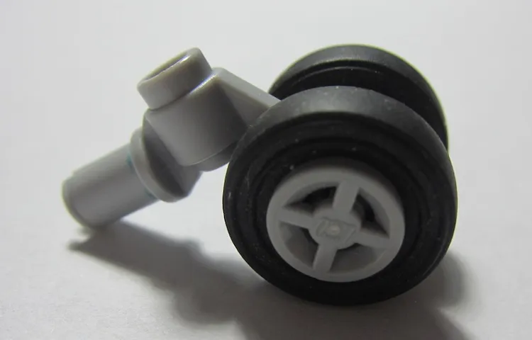 Technic Pin with Dual Wheels Holder with Light Bluish Gray Wheels and Black Tires (61483 / 4624 / 3139)