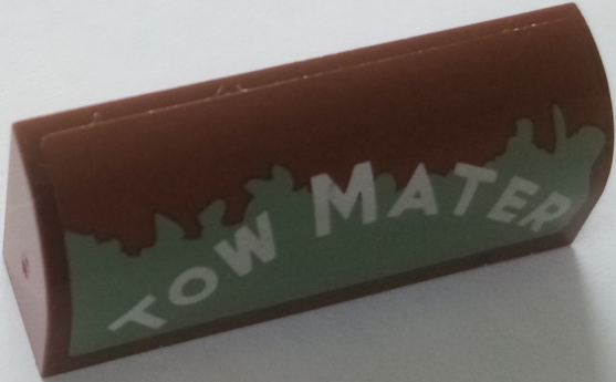 Slope, Curved 1 x 4 x 1 1/3 with White 'TOW MATER' on Worn Sand Green Background Pattern Model Left Side (Sticker) - Set 8677