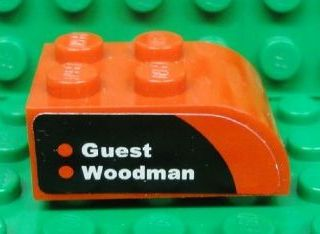 Slope, Curved 3 x 2 with 4 Studs with 'Guest' and 'Woodman' on Black and Red Background Pattern Model Left Side (Sticker) - Set 8655