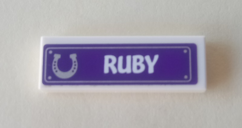 Tile 1 x 3 with Horseshoe and 'RUBY' on Dark Purple Background Pattern (Sticker) - Set 41057