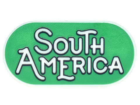 Tile, Round 2 x 4 Oval with Black Outline 'SOUTH AMERICA' on Green Background Pattern