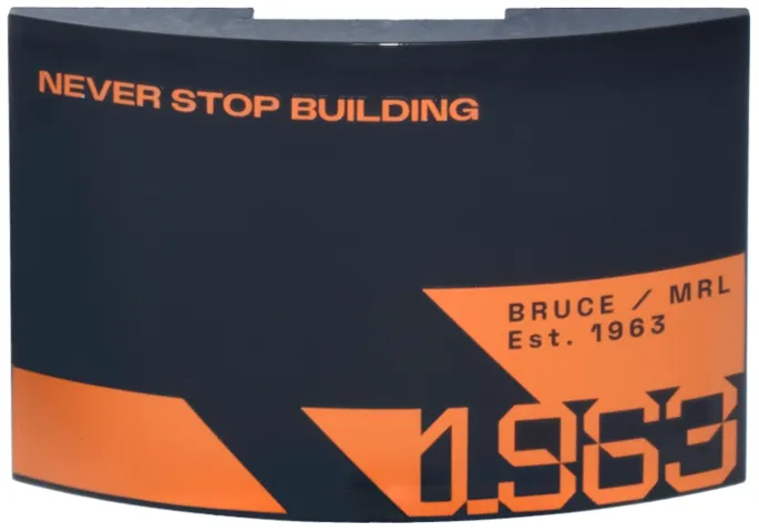 Slope, Curved 6 x 4 Double with Orange 'NEVER STOP BUILDING', Stylized '1963', Triangle and Trapezoids, 'BRUCE / MRL Est. 1963' Pattern Model Right Side