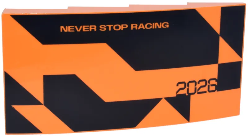 Slope, Curved 8 x 4 x 1 2/3 with Black Triangles, Angled Shapes and Stylized '2026', 'NEVER STOP RACING' Pattern Model Right Side