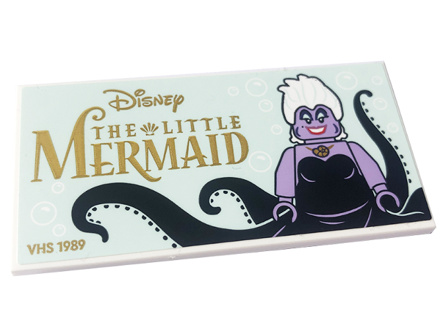 Tile, Modified 4 x 8 Inverted with Studs on Edges with Ursula Minifigure, Gold 'Disney', 'THE LITTLE MERMAID' and 'VHS 1989' on Light Aqua Background Pattern (Sticker) - Set 43227