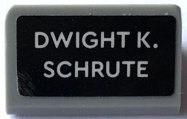 Slope 30 1 x 2 x 2/3 with 'DWIGHT K. SCHRUTE' Pattern (Sticker) - Set 21336