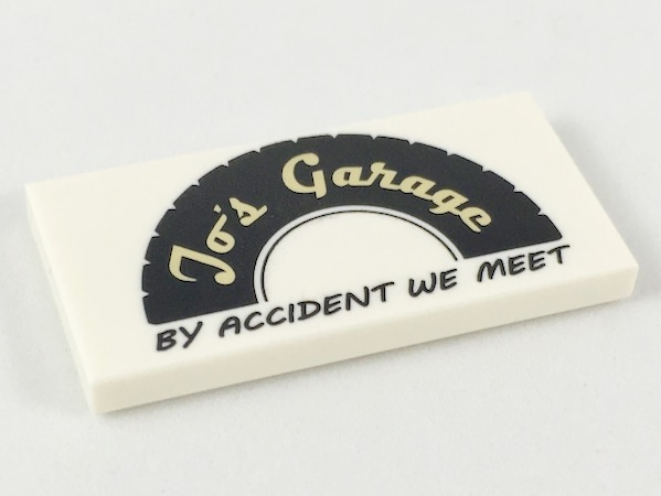 Tile 2 x 4 with Black Tire Half with Tan 'Jo's Garage' and Black 'BY ACCIDENT WE MEET' Pattern