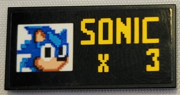 Tile 2 x 4 with Pixelated Sonic the Hedgehog Head and Yellow 'SONIC x 3' Pattern (Sticker) - Set 21331