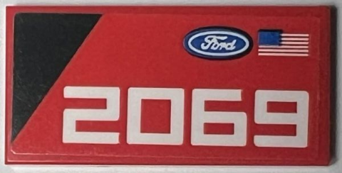 Tile 2 x 4 with Ford Logo, United States of America (USA) Flag, Black Triangle, and White '2069' Pattern Model Left Side (Sticker) - Set 76905