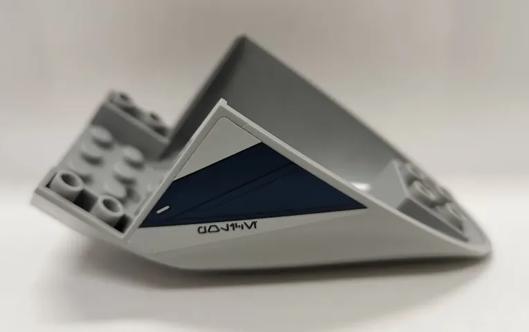 Aircraft Fuselage Aft Section Curved Bottom 6 x 10 with Dark Blue Trapezoid and Aurebesh Characters 'POLICE' on Light Bluish Gray Background Pattern on Both Sides (Stickers) - Set 75046