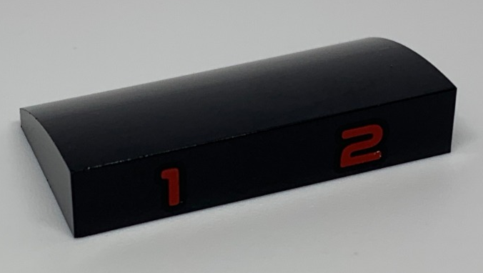 Slope, Curved 2 x 4 x 2/3 with Bottom Tubes with Red Number 1 and 2 Pattern