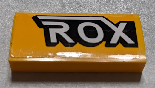 Slope, Curved 2 x 4 x 2/3 with Bottom Tubes with Black and White 'ROX' Pattern Side A (Sticker) - Set 76067