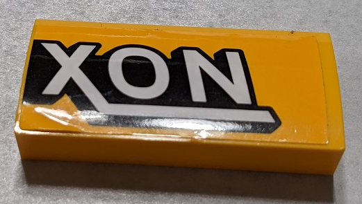 Slope, Curved 2 x 4 x 2/3 with Bottom Tubes with Black and White 'XON' Pattern Side B (Sticker) - Set 76067