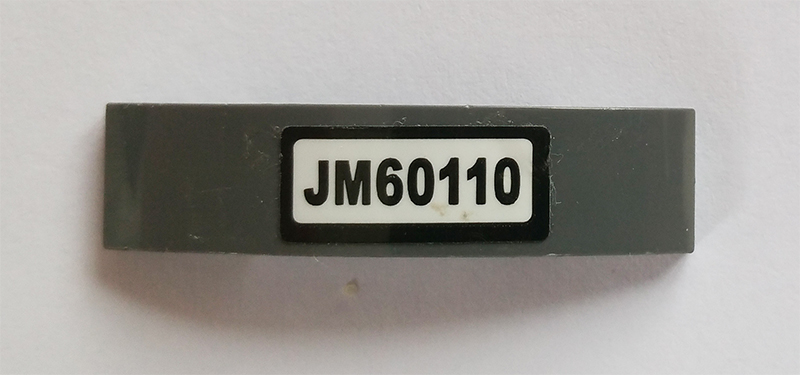 Slope, Curved 4 x 1 x 2/3 Double with 'JM60110' Pattern (Sticker) - Set 60110