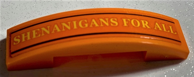 Slope, Curved 4 x 1 x 2/3 Double with Yellow 'SHENANIGANS FOR ALL' and Black Lines Pattern (Sticker) - Set 75978