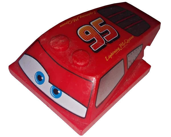 Wedge 6 x 4 x 1 1/3 with 4 x 4 Base with Blue Eyes, Windows and Red and Yellow '95' Pattern