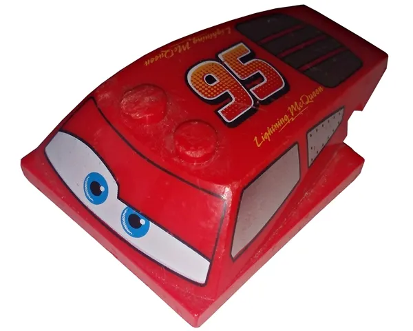 Wedge 6 x 4 x 1 1/3 with 4 x 4 Base with Blue Eyes, Windows and Red and Yellow '95' Pattern