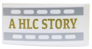 Slope, Curved 4 x 2 with Gold 'A HLC STORY' with Light Bluish Gray Filmstrip Edges Pattern Model Left Side (Sticker) - Set 41448