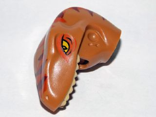 Dinosaur Head Raptor with Pin Hole with Tan Teeth and Dark Orange and Dark Brown Stripes Pattern