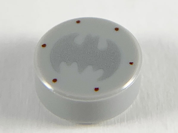 Tile, Round 1 x 1 with Silver Bat Batman Logo and 6 Reddish Brown Rivets Pattern