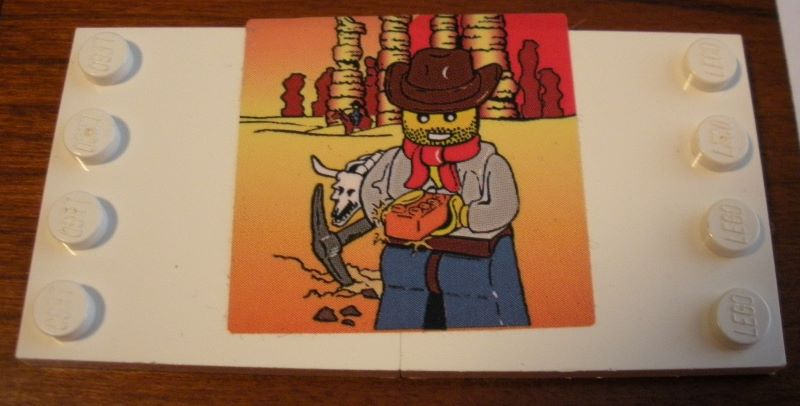 Stickered Assembly 8 x 4 with Minifigure in Cowboy Hat and Red Bandana Pattern (Sticker) - Set 10184 - 2 Tile, Modified 4 x 4 with Studs on Edge