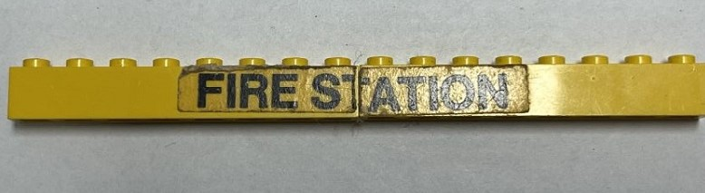 Stickered Assembly 16 x 1 x 1 with Black 'FIRE STATION' Pattern (Sticker) - Set 374-1 - 2 Brick 1 x 8