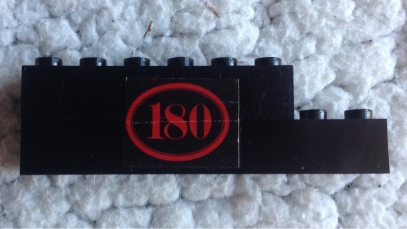 Stickered Assembly 8 x 1 x 2 with Red '180' with Oval Border on Black Background Pattern Model Right Side (Sticker) - Set 180 - 1 Brick 1 x 6, 1 Brick 1 x 8